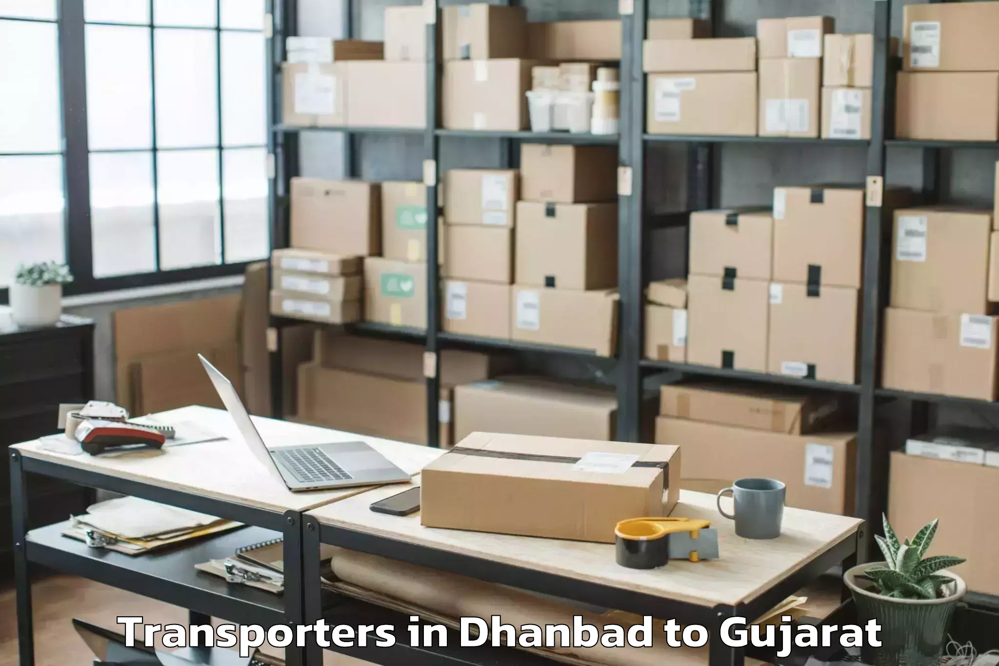 Get Dhanbad to Hansot Transporters